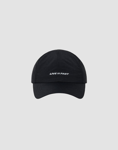 The Live Fast Performance Cap by LIVE FAST DIE YOUNG is a black, größenverstellbar nylon cap with “LIVE 2 FAST” embroidered in white, featuring reflective print and shown on a plain light gray background.