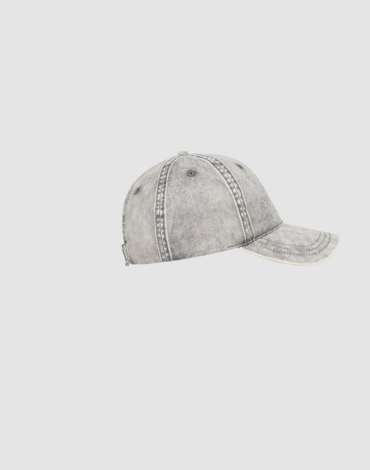 The Live Fast Paris Cap by LIVE FAST DIE YOUNG is a gray, distressed baseball cap with visible stitching, a curved brim, Sunfade Optik, and a Metallschnalle, displayed in profile against a plain light background.