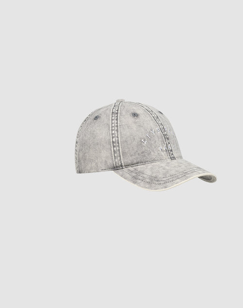 The Live Fast Paris Cap by LIVE FAST DIE YOUNG is a gray, distressed denim baseball cap in Sunfade Optik, featuring visible stitching, subtle front text, and a Metallschnalle closure, shown against a plain light gray background.