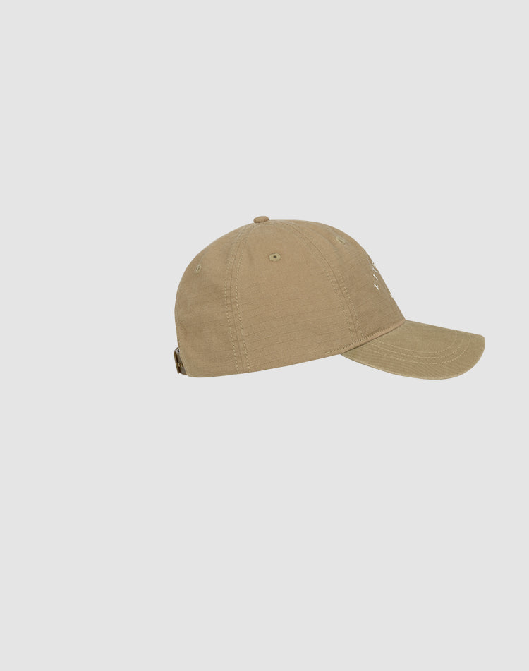 The Live Fast Paris Cap by LIVE FAST DIE YOUNG is a khaki-colored baseball cap made from 100% Baumwolle, featuring a curved brim and Snapverschluss, shown in a side view against a plain light gray background.