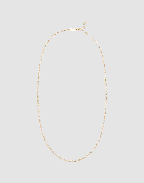 The LIVE FAST DIE YOUNG Basic Figaro Chain is a delicate 925 gold-plated necklace with an adjustable length and simple clasp, shown on a plain light gray background.
