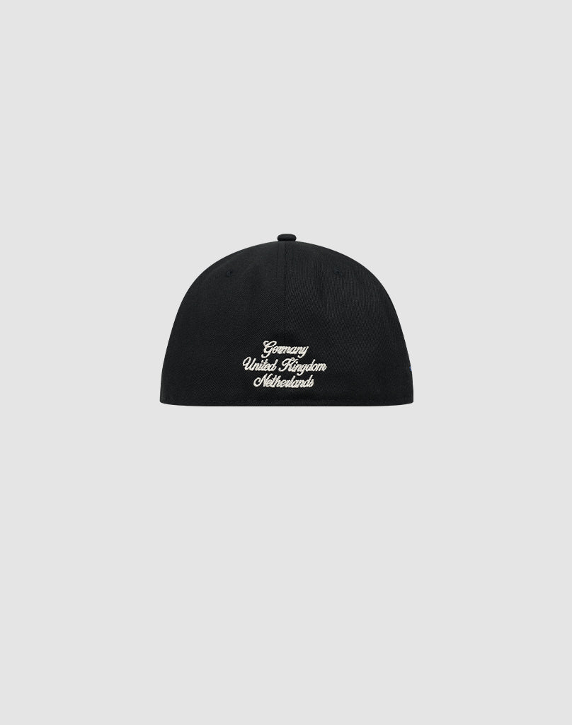 The LFDY X NEW ERA 59FIFTY fitted cap by LIVE FAST DIE YOUNG is shown in black, with white embroidered Germany United Kingdom Netherlands text on the back. Displayed on a plain light gray background. Größentabelle available for sizing.