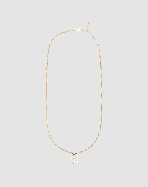 The DY Blank Chain by LIVE FAST DIE YOUNG is a gold necklace with a pendant of overlapping N and Y letters in a stylized font, made from 925 Vergoldet Sterling Silber, shown on a plain light gray background.