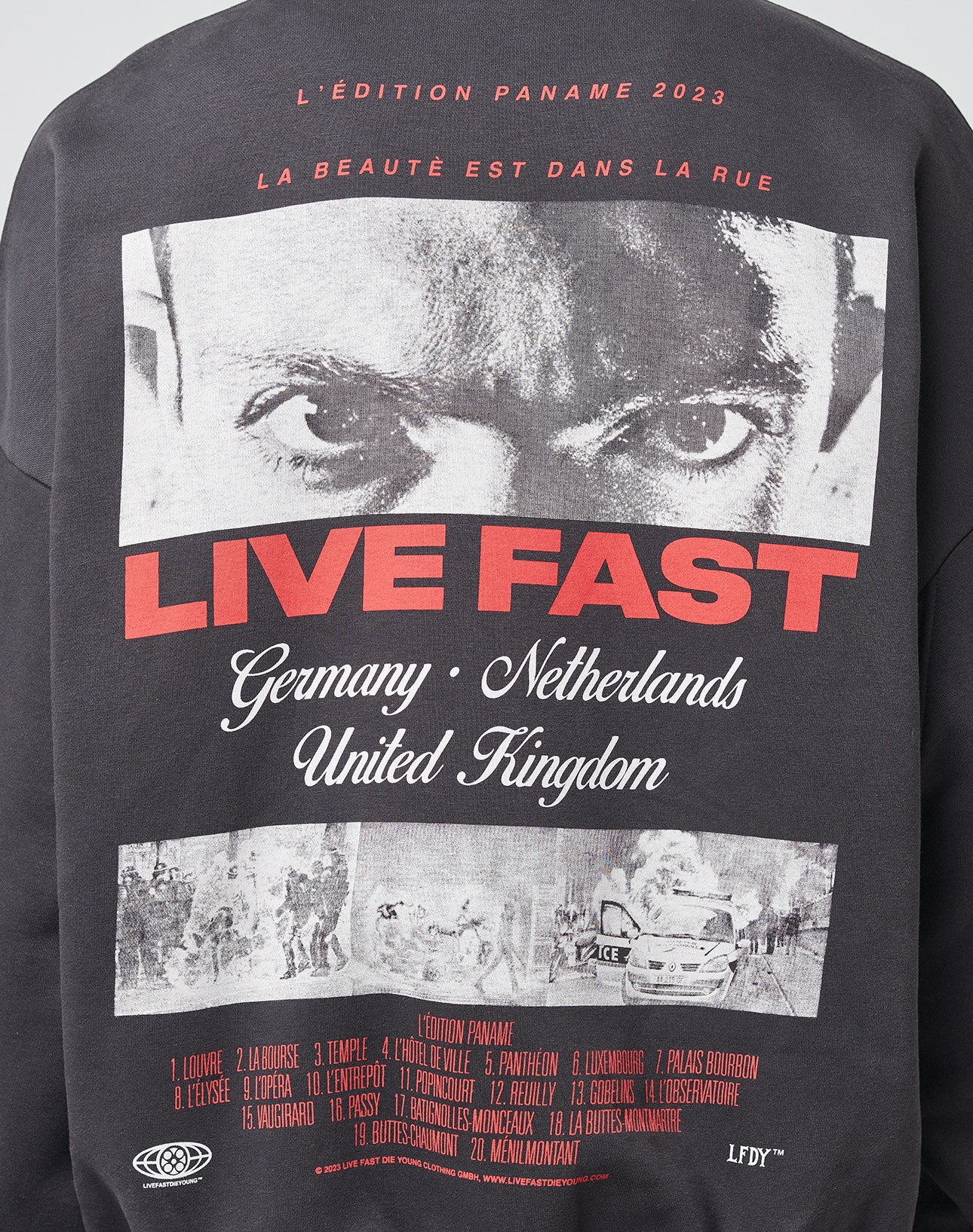 The LFDY Cinema Sweater by LIVE FAST DIE YOUNG features an Oversize Fit, close-up black-and-white face on top, bold red LIVE FAST text, Germany/Netherlands/United Kingdom names below, plus red-and-white front and back prints.