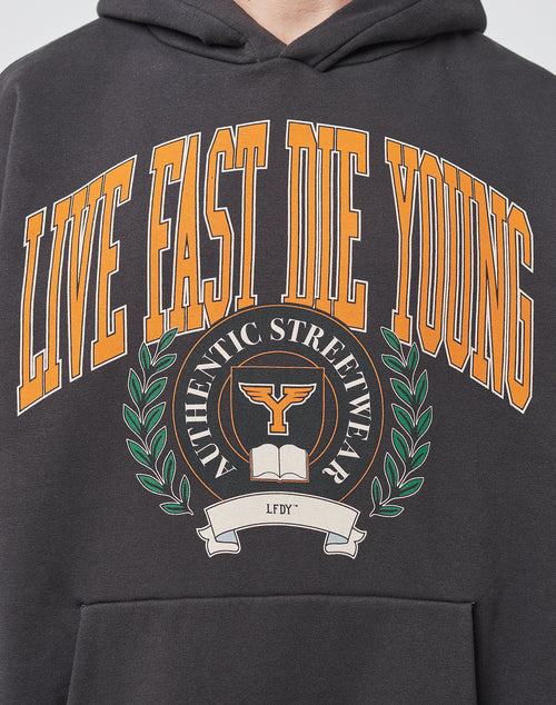 A close-up of the LIVE FAST DIE YOUNG Hooded in black, showcasing bold orange and white text with a vintage effect above a crest labeled AUTHENTIC STREETWEAR and a white LFDY banner.