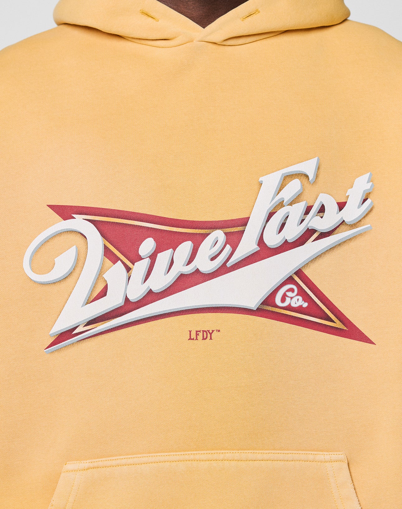 The LFDY Corp. Hooded by LIVE FAST DIE YOUNG is a yellow, oversized hoodie featuring a bold "Live Fast Co." frontprint with spray effect and LFDY printed underneath for a standout modern look.