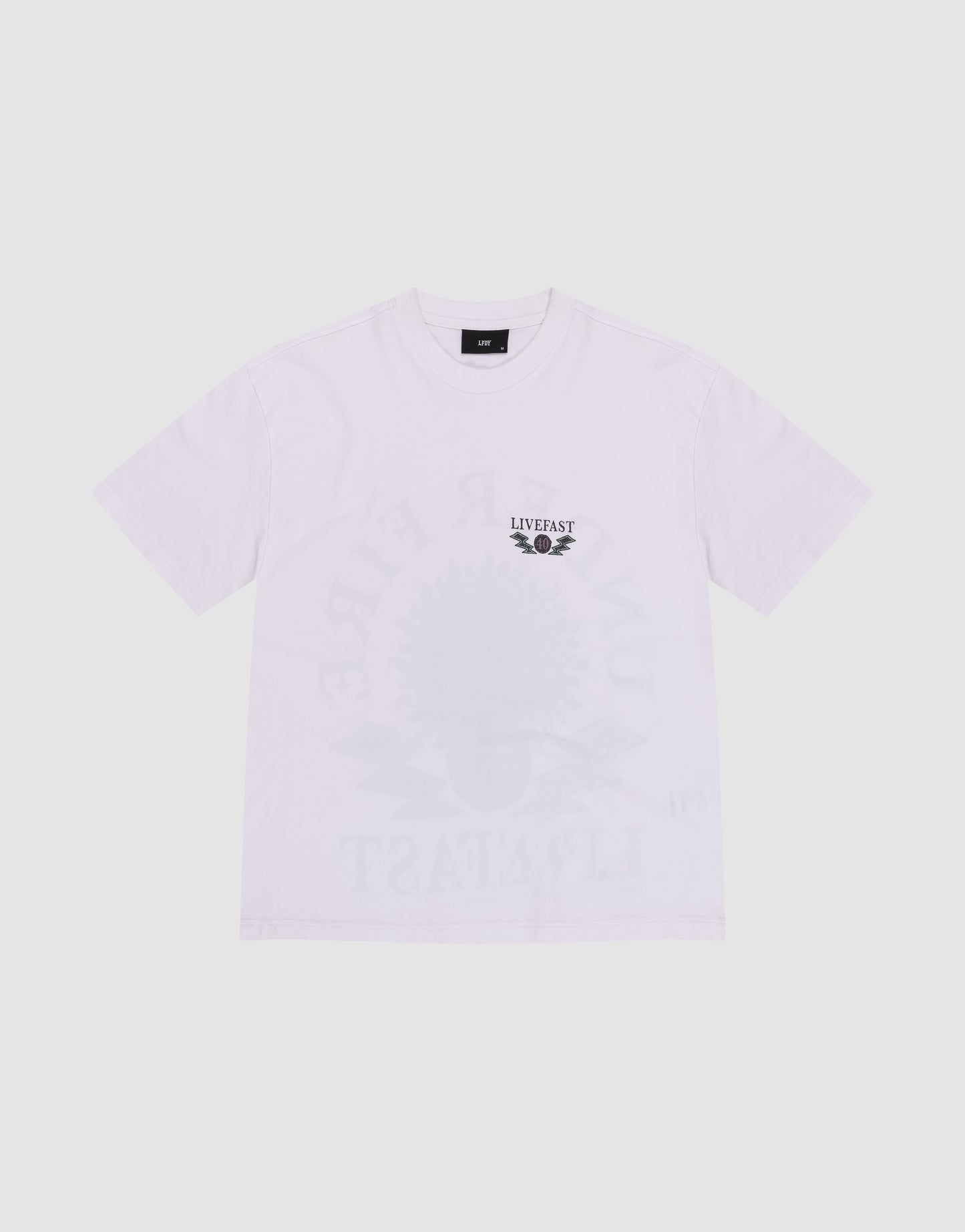 The LFDY Under Fire Tee by LIVE FAST DIE YOUNG is a white, oversize-fit short-sleeve shirt with a small winged wheel LIVE FAST graphic on the left chest, subtle front and back prints, and made from 100% Baumwolle for comfort.