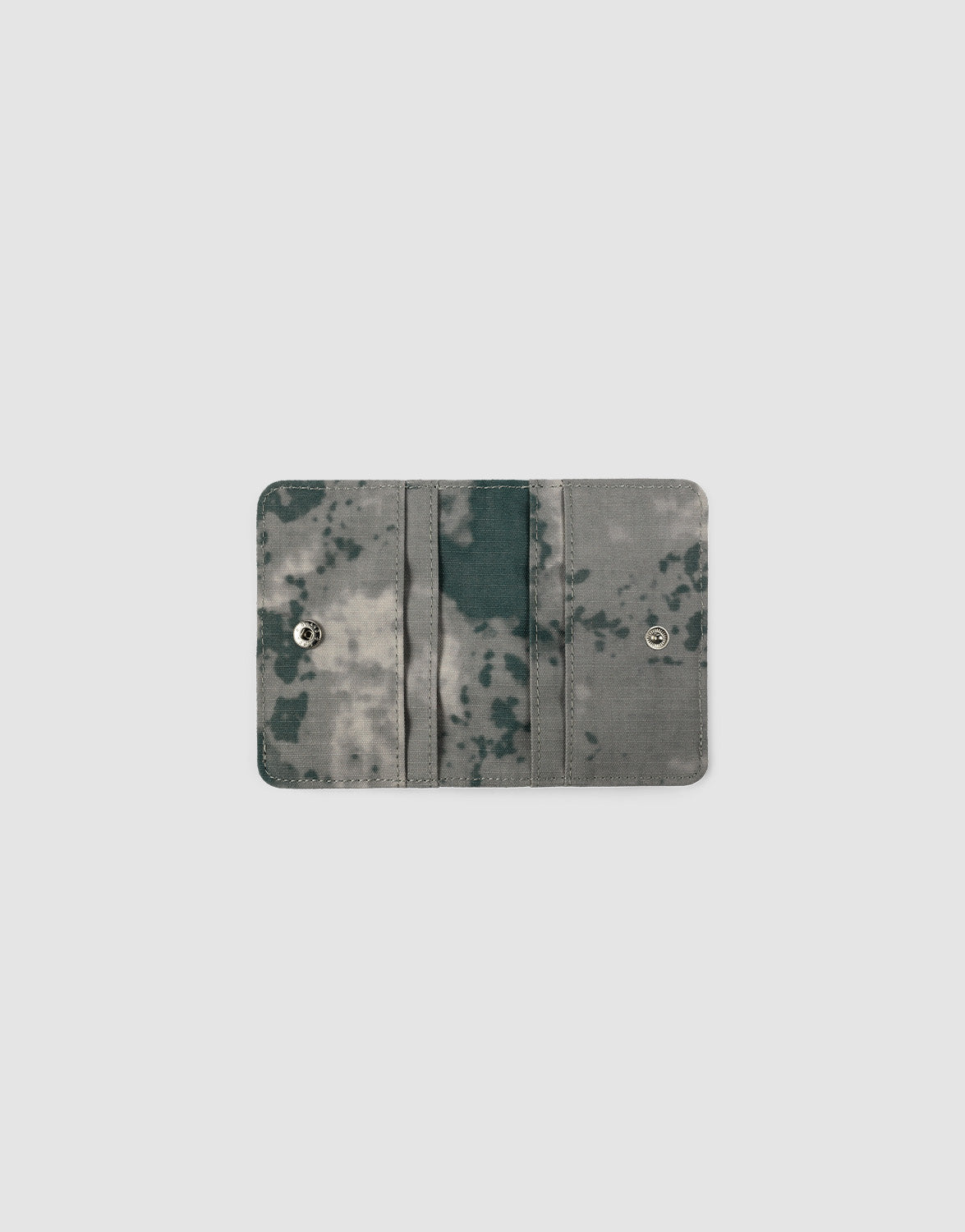 A compact, rectangular LFDY Cardholder by LIVE FAST DIE YOUNG features a gray and black tie-dye design, open to display two snap buttons, multiple card slots, and a side slit against a plain white background.