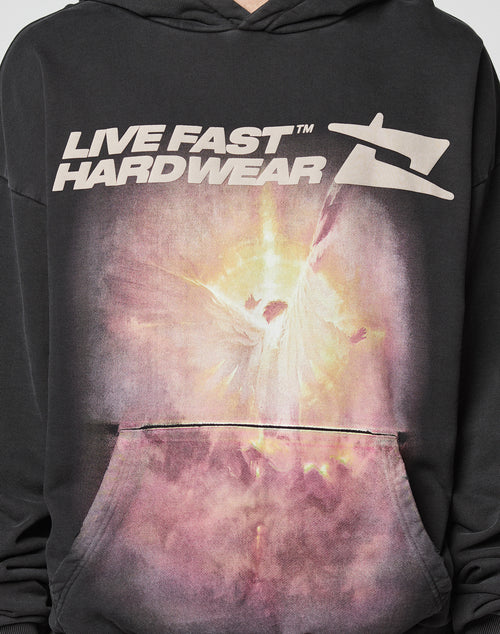 The LFDY Angel Hooded by LIVE FAST DIE YOUNG is a black hoodie with an Oversize Fit, featuring bold LIVE FAST HARDWEAR text and an abstract glowing figure graphic on the front pocket area. Made from 100% Baumwolle for premium comfort.