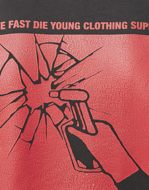 The Hit and Run Hooded by LIVE FAST DIE YOUNG features a cracked backprint of a hand firing a gun through shattered glass, with bold red and black colors and “LIVE FAST DIE YOUNG CLOTHING SUP” text above the graphic.