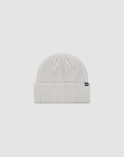 The Double Rib Knit Beanie by LIVE FAST DIE YOUNG is a light gray, doppellagig gestrickt hat with a folded cuff and a small black rectangular tag, shown on a plain white background.