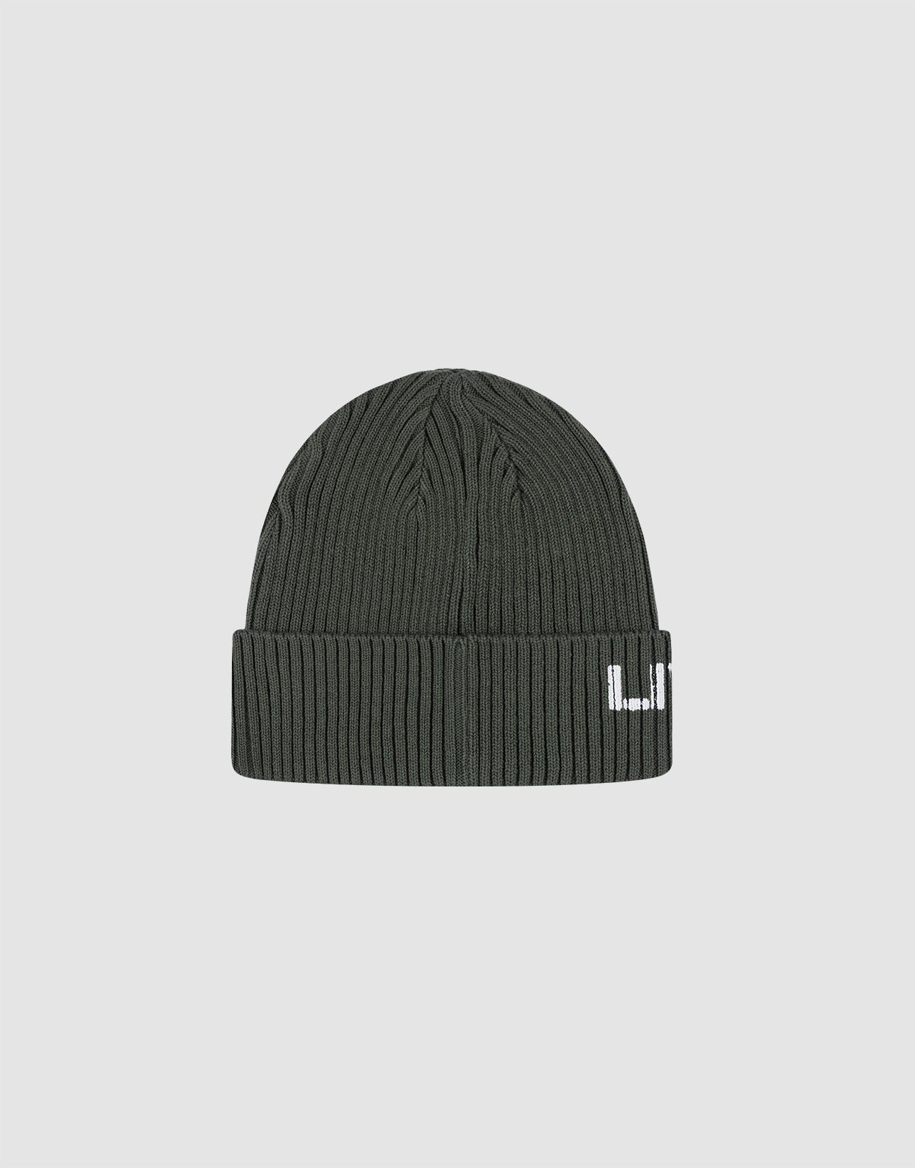 The Live Fast Army Beanie by LIVE FAST DIE YOUNG is a dark green ribbed knit beanie crafted from 100% Baumwolle, with a folded brim and a small white rectangular frayed web label on the front, shown against a plain light gray background.