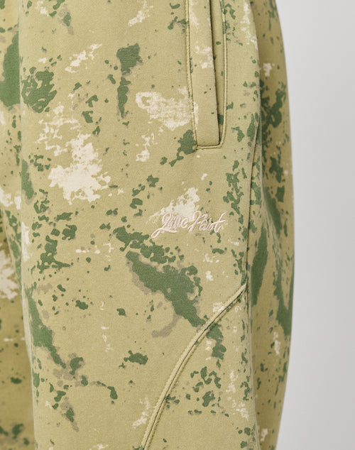 Close-up of the Camo Wide Jogger by LIVE FAST DIE YOUNG, featuring light green and beige camo with side pocket, white Live Fast embroidery, elastic waist, wide fit, and soft cotton for all-day comfort.