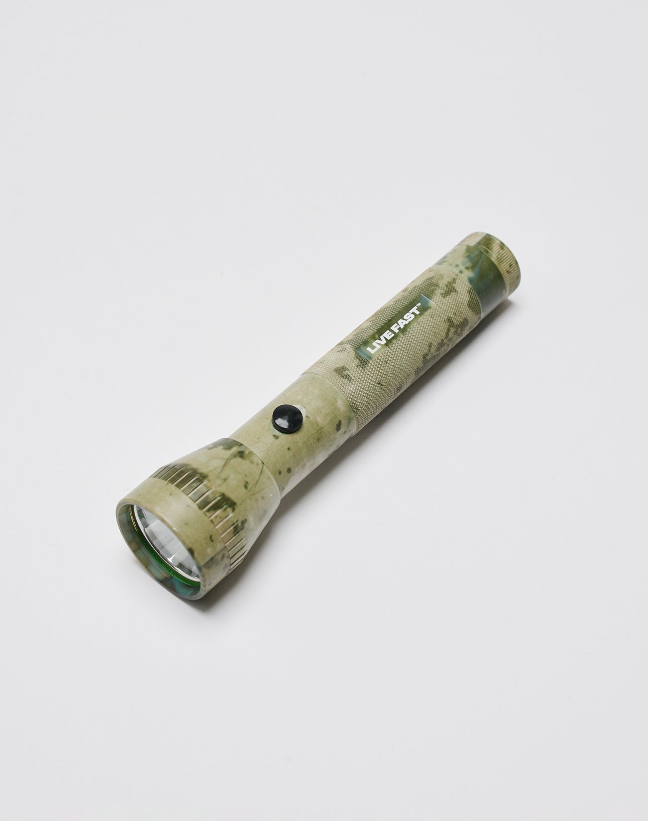 A camo-patterned LED flashlight called Live Fast Flashlight, featuring a black button and the LIVE FAST DIE YOUNG brand on its aluminum body, is displayed against a plain white background.