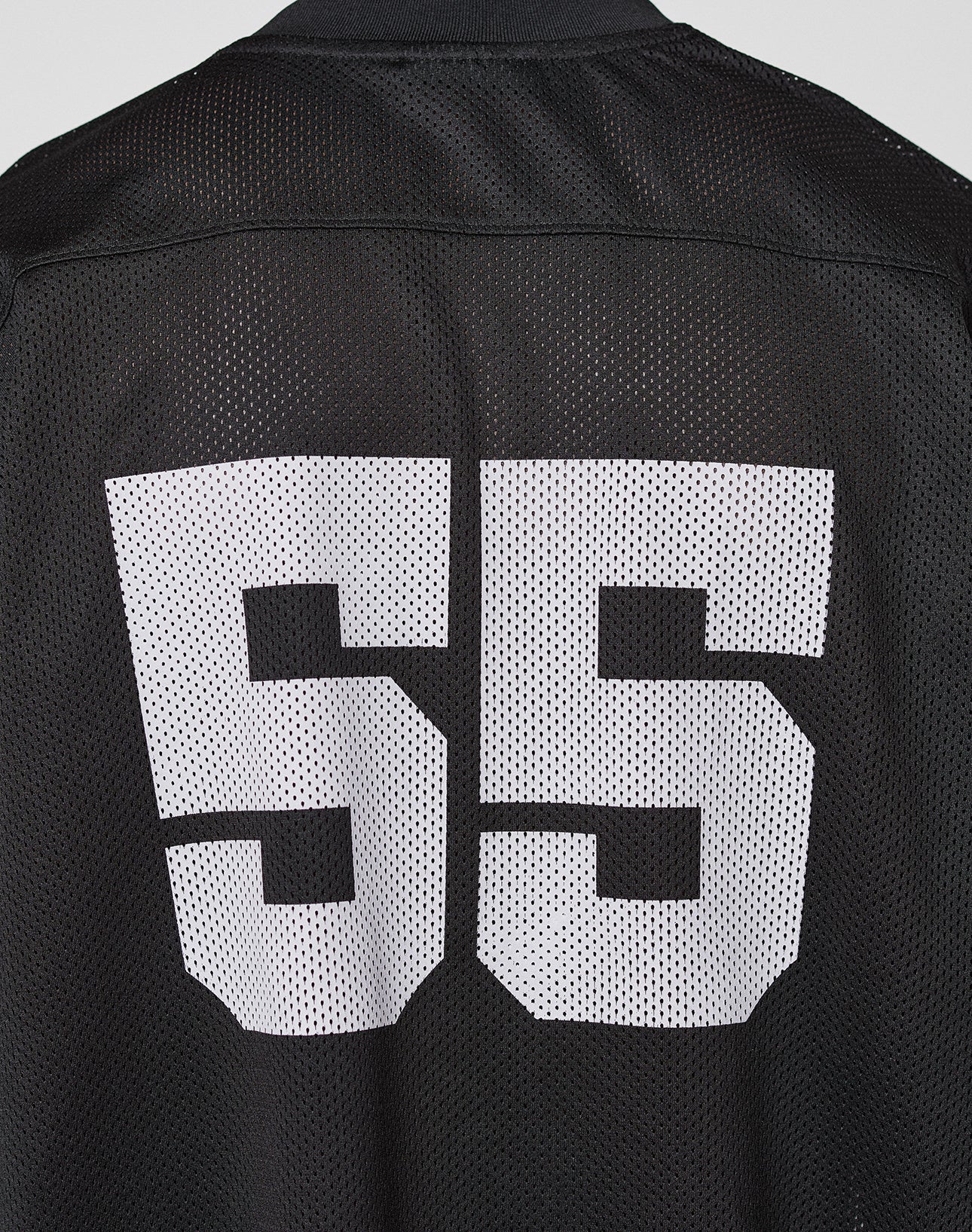 The LFDY Mesh Jersey by LIVE FAST DIE YOUNG is a black polyester sports jersey with an oversized fit, featuring large white block number 55 on the back.