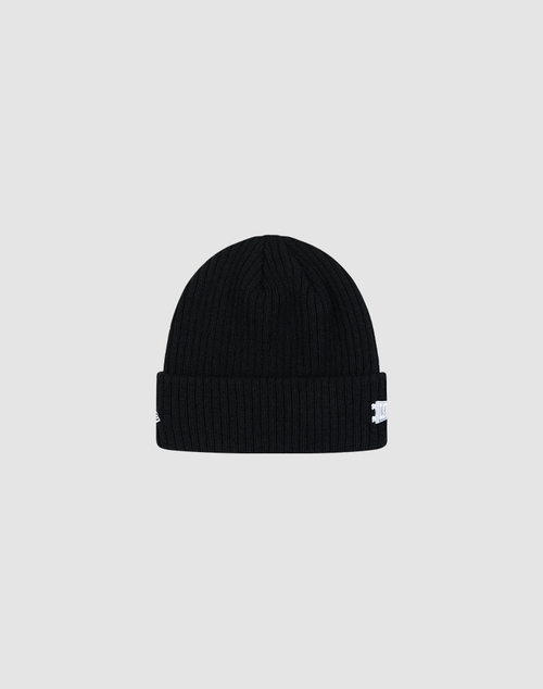 The LFDY x New Era Beanie by LIVE FAST DIE YOUNG is a black, ribbed knit beanie with a folded brim and a small white DY Logo tag on the side, shown against a plain light gray background.