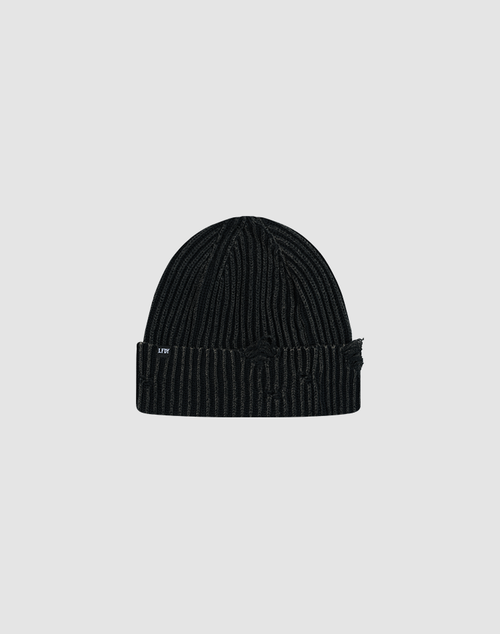 The LIVE FAST DIE YOUNG Distressed Rib Knit Beanie is a black 100% Baumwolle beanie with subtle vertical stripes, a folded brim, and a white LFW flag label on the side, shown on a plain light gray background.