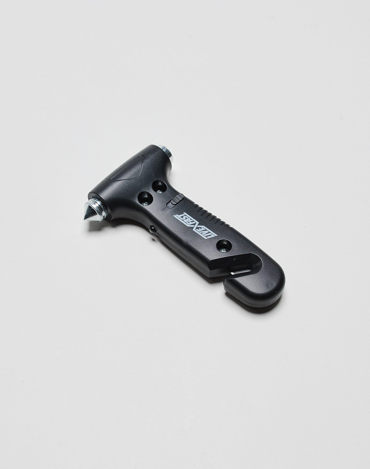 The LFDY Emergency Hammer by LIVE FAST DIE YOUNG is a black, one-size car safety tool with a pointed metal tip for breaking glass and a concealed seatbelt cutter. Subtle logo print. Displayed on a plain white background.