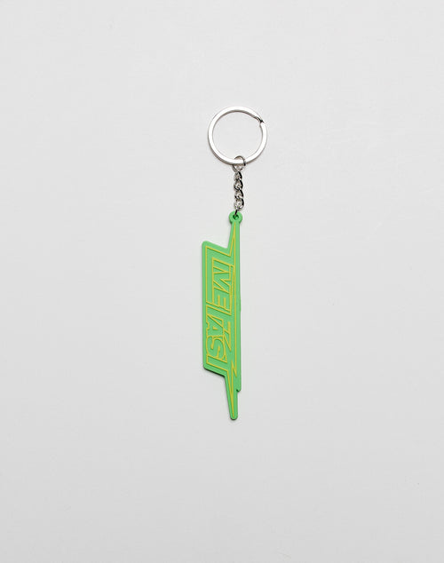 A green Live Fast Keychain by LIVE FAST DIE YOUNG, featuring LIVE FAST in bold letters and a metal ring, shown against a plain white background.