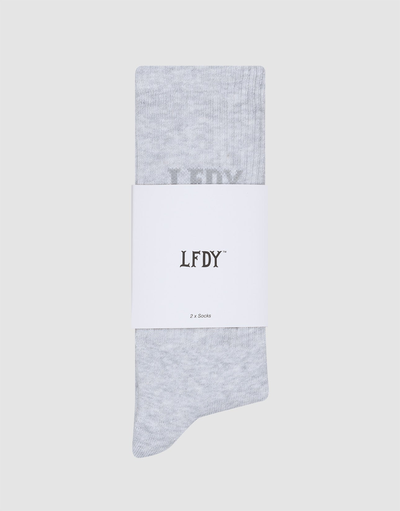 A pair of light grey LFDY Logo Socks (2 Pack) by LIVE FAST DIE YOUNG, folded vertically and wrapped with a white label reading LFDY and 2er Set in black text, displayed on a plain light grey background.
