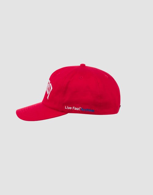 A bright red Live Fast Unstructured Cap by LIVE FAST DIE YOUNG, with white and blue Live Fast Archive embroidery on the side, classic Logo-Stick detail, and Mit Snapverschluss. Displayed on light gray. One size fits most.