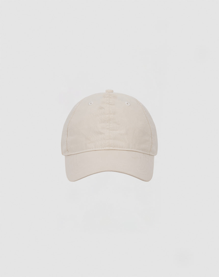 The LIVE FAST DIE YOUNG Basic Cap is a plain beige baseball cap crafted from soft cotton, shown front-facing against a light gray background.