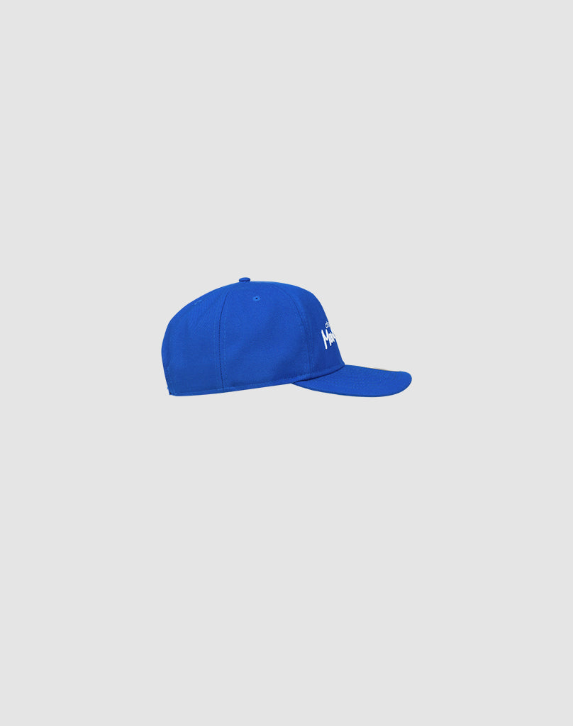 A side view of the royal blue LFDY X NEW ERA Monaco Boys 9Fifty A-Frame cap by LIVE FAST DIE YOUNG, displayed on a plain light gray background.
