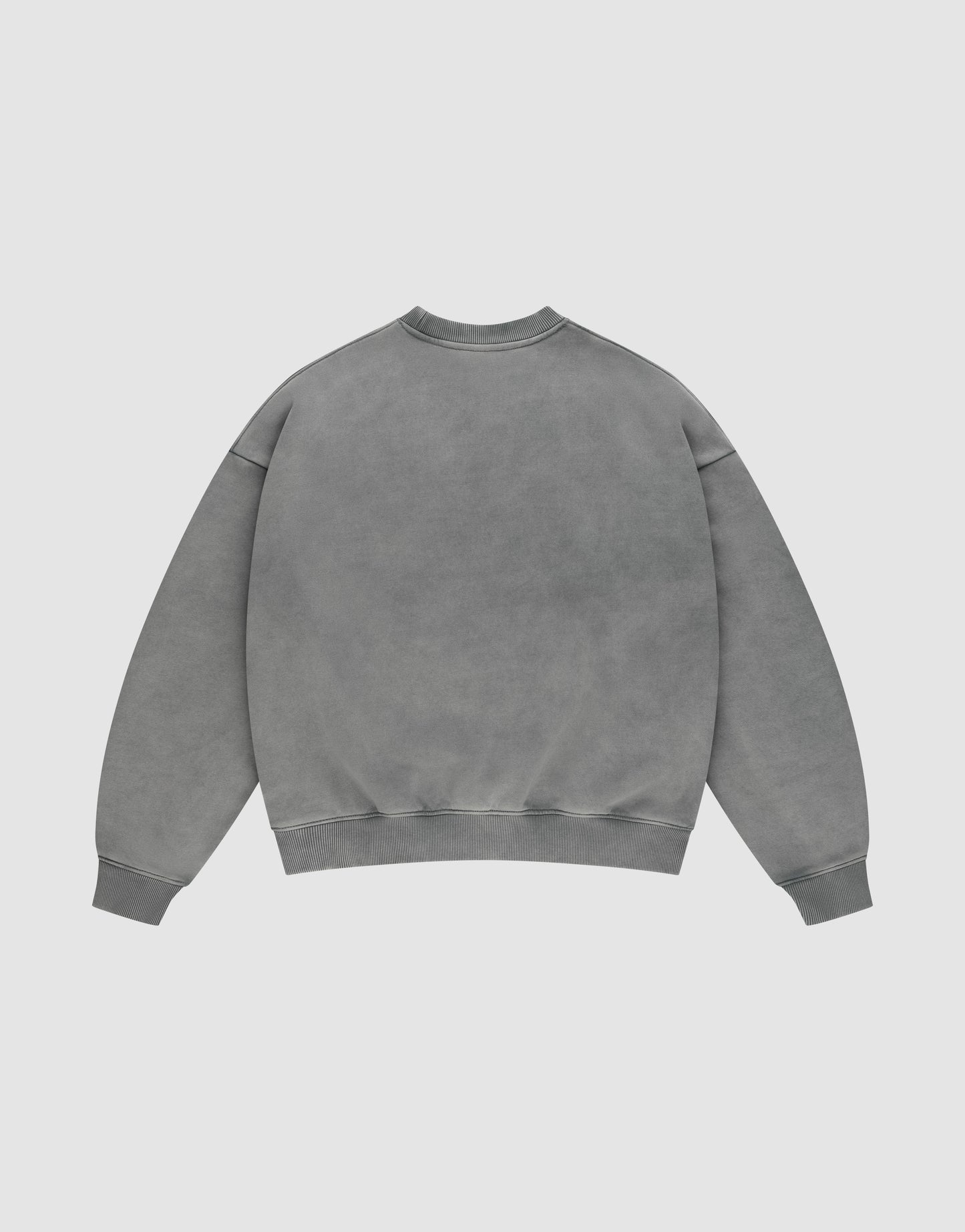 The LIVE FAST DIE YOUNG Live Fast Europe Run Sweater, a plain grey oversize-fit crewneck with long sleeves, is shown laid flat with the back facing up against a light background.