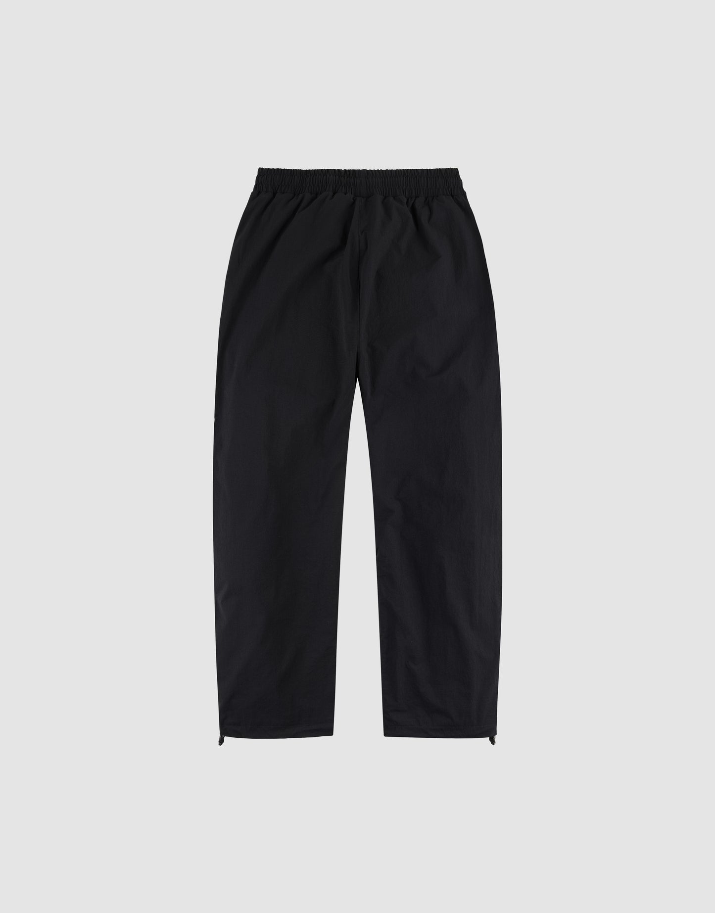 The LFDY Wavy Trackpants by LIVE FAST DIE YOUNG are black, wide fit pants with an elastic waistband and straight legs, shown flat on a light gray background.