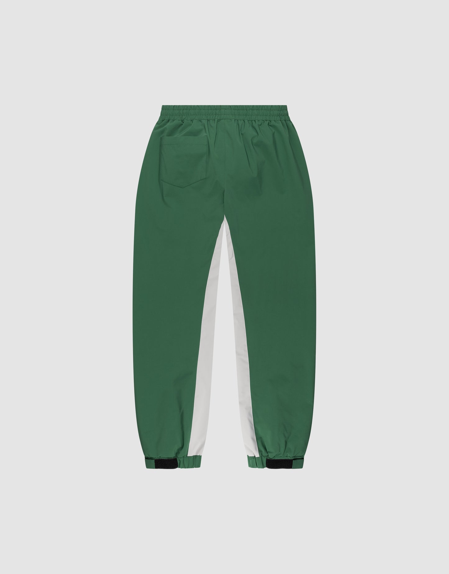 LIVE FAST DIE YOUNG Basic Shell Pants: Green with elastic waistband, back pocket, white inner side panels, elastic cuffs, black adjustable ankle straps, and a modern oversize fit for comfort.