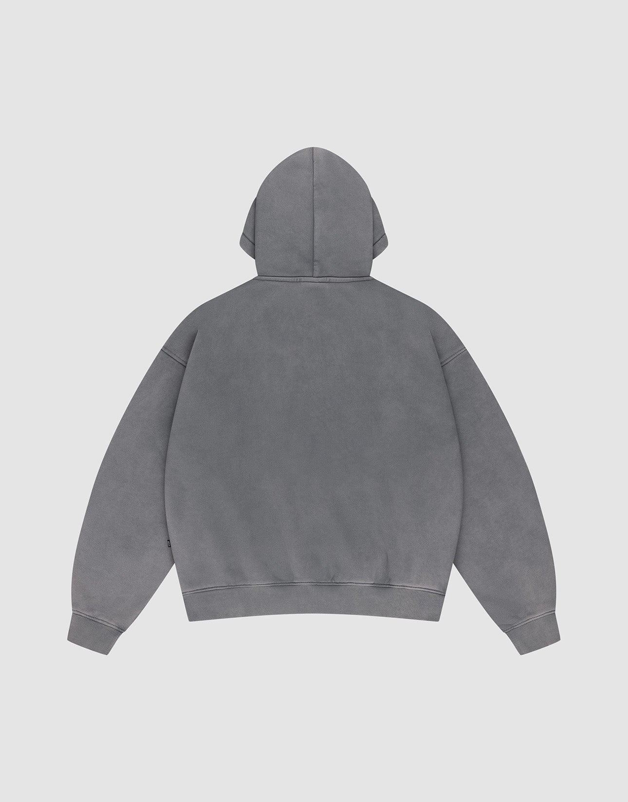 The Basic +49 Hooded by LIVE FAST DIE YOUNG is shown flat, back side up, on a light gray background. This oversized hoodie features long sleeves, soft cotton fabric, and a plain gray look with no visible logos or designs.