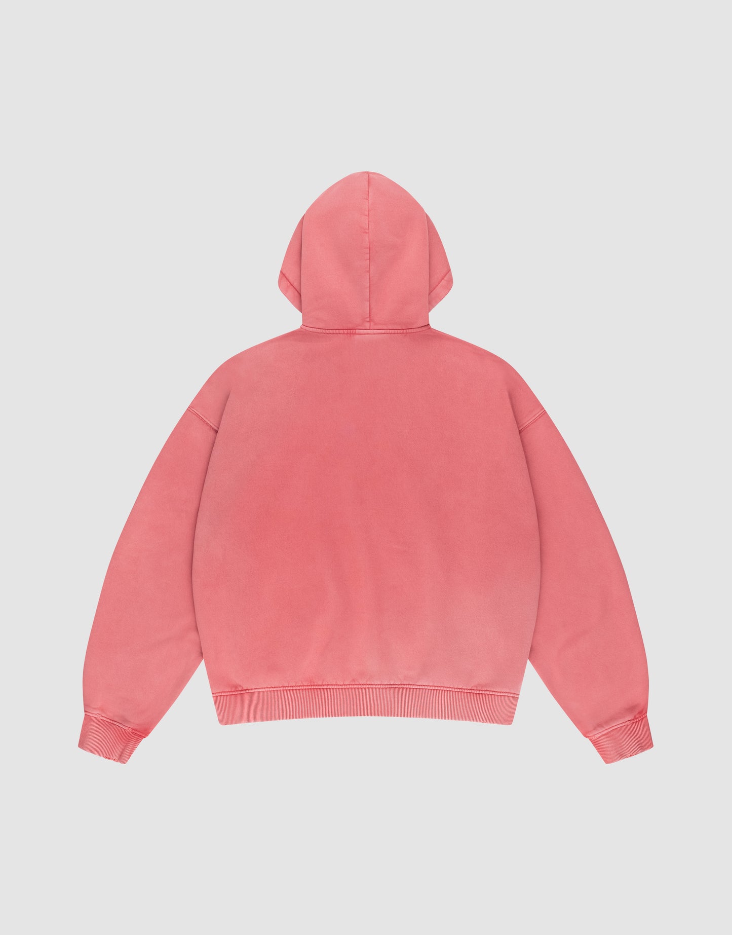 A pink Basic Hooded Zip from LIVE FAST DIE YOUNG is laid flat, back facing up, on a white background. It has an oversize fit, long sleeves, and features no visible designs or logos.