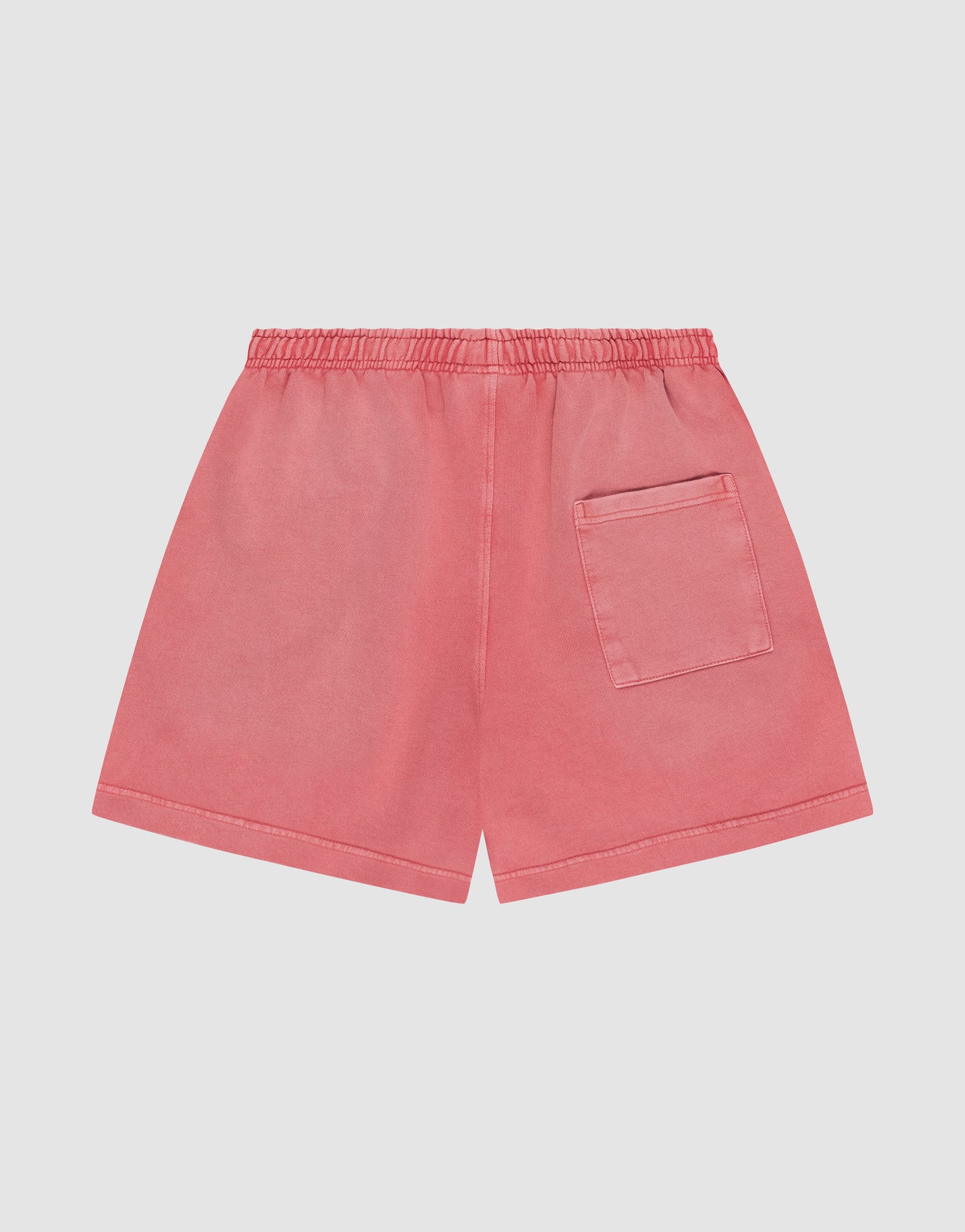LIVE FAST DIE YOUNG Basic Sweat Shorts in pink, featuring an elastic waistband, a single back pocket, and a subtle faded finish, shown flat on a white background.
