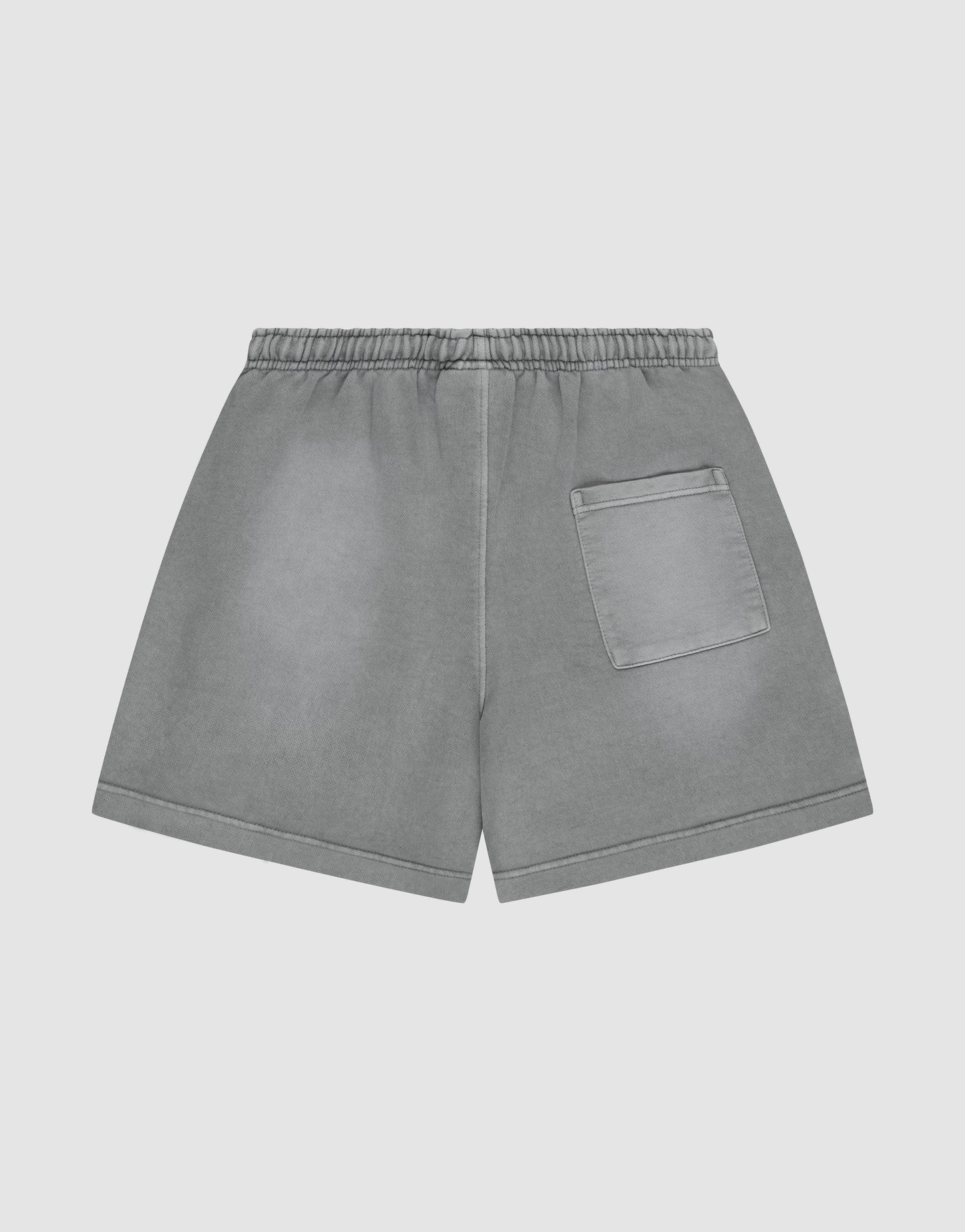 LIVE FAST DIE YOUNG Basic Sweat Shorts with an elastic waistband, single right back pocket, oversized fit, and subtle faded look, shown on a plain light background.