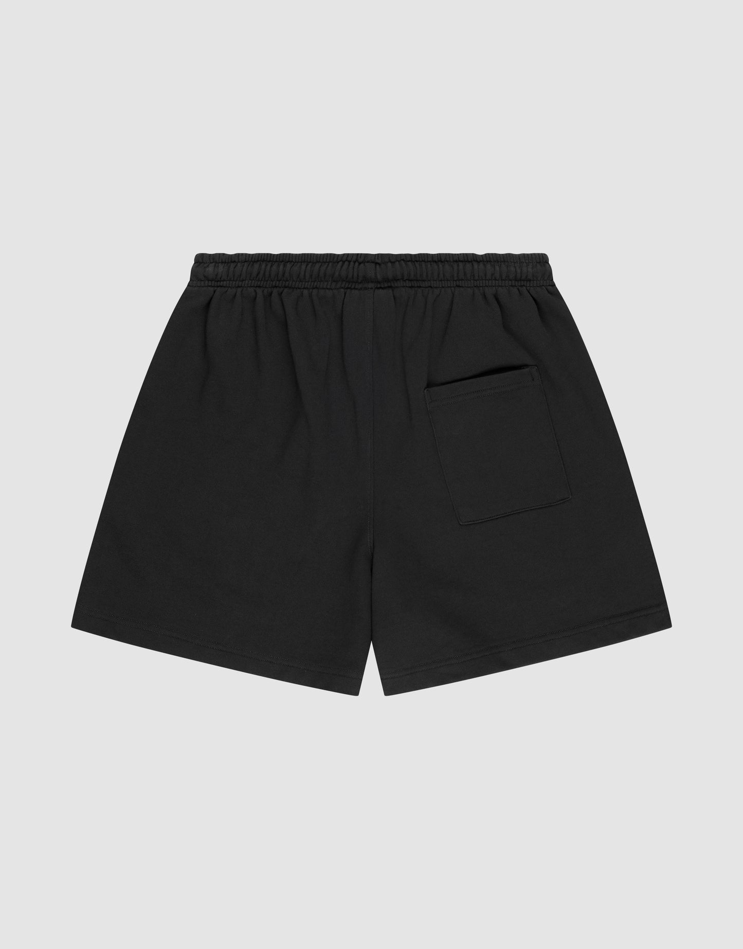 LIVE FAST DIE YOUNG Basic Sweat Shorts in black with an elastic waistband, single back pocket, and subtle logo print, shown flat on a light gray background.