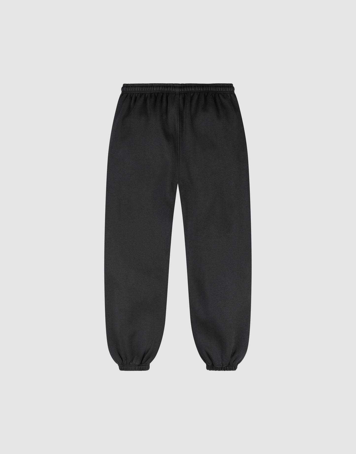 The LIVE FAST DIE YOUNG Basic Loose Jogger is a black sweatpant with an elastic waistband and ankle cuffs, plus a subtle logo print, shown against a plain light gray background.