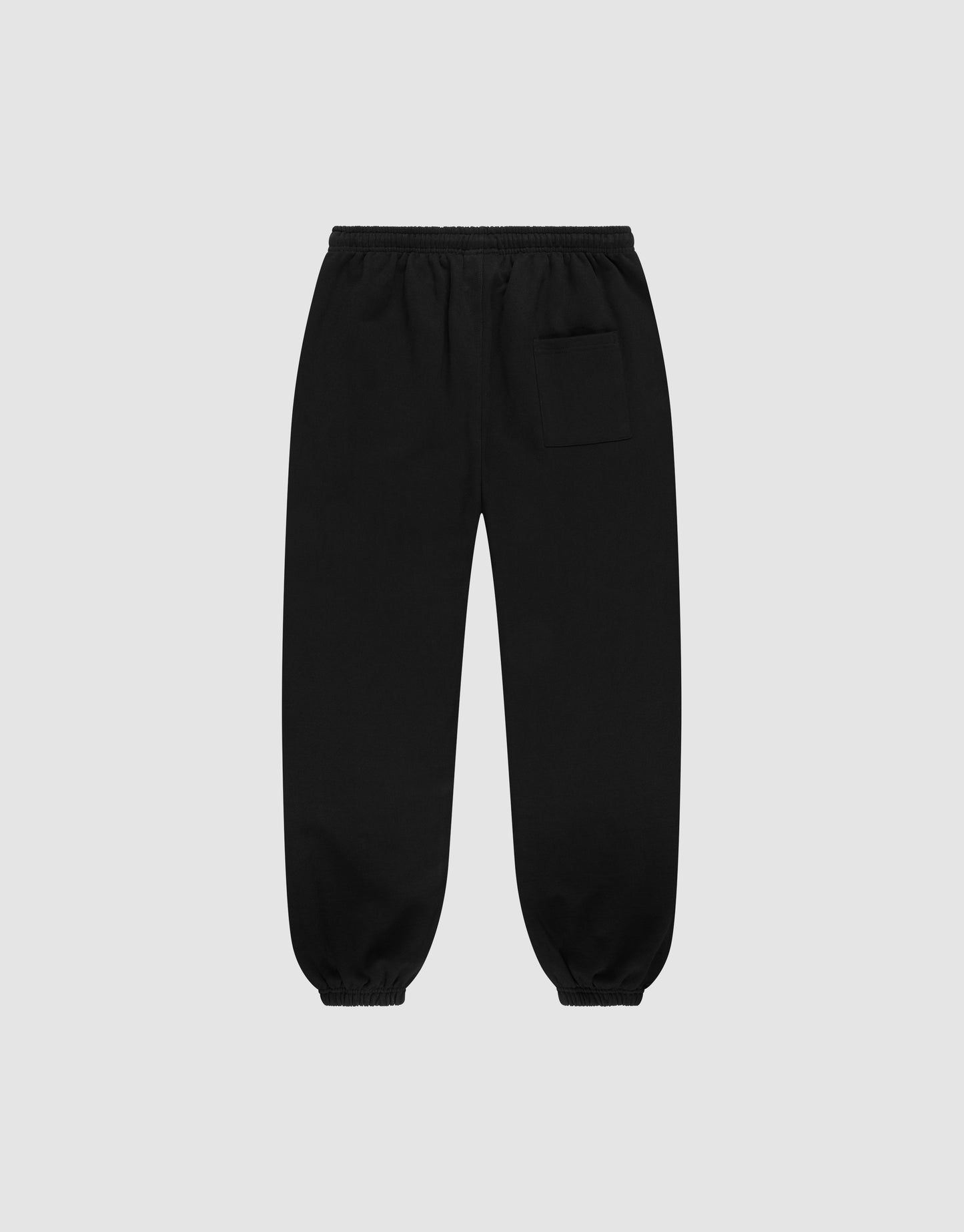 The LIVE FAST DIE YOUNG Wide Cuff Jogger is a black, wide-fit sweatpant made from 100% Baumwolle French Terry, featuring an elastic waistband, cuffs, and a small pocket on the upper right thigh, displayed on a light gray background.
