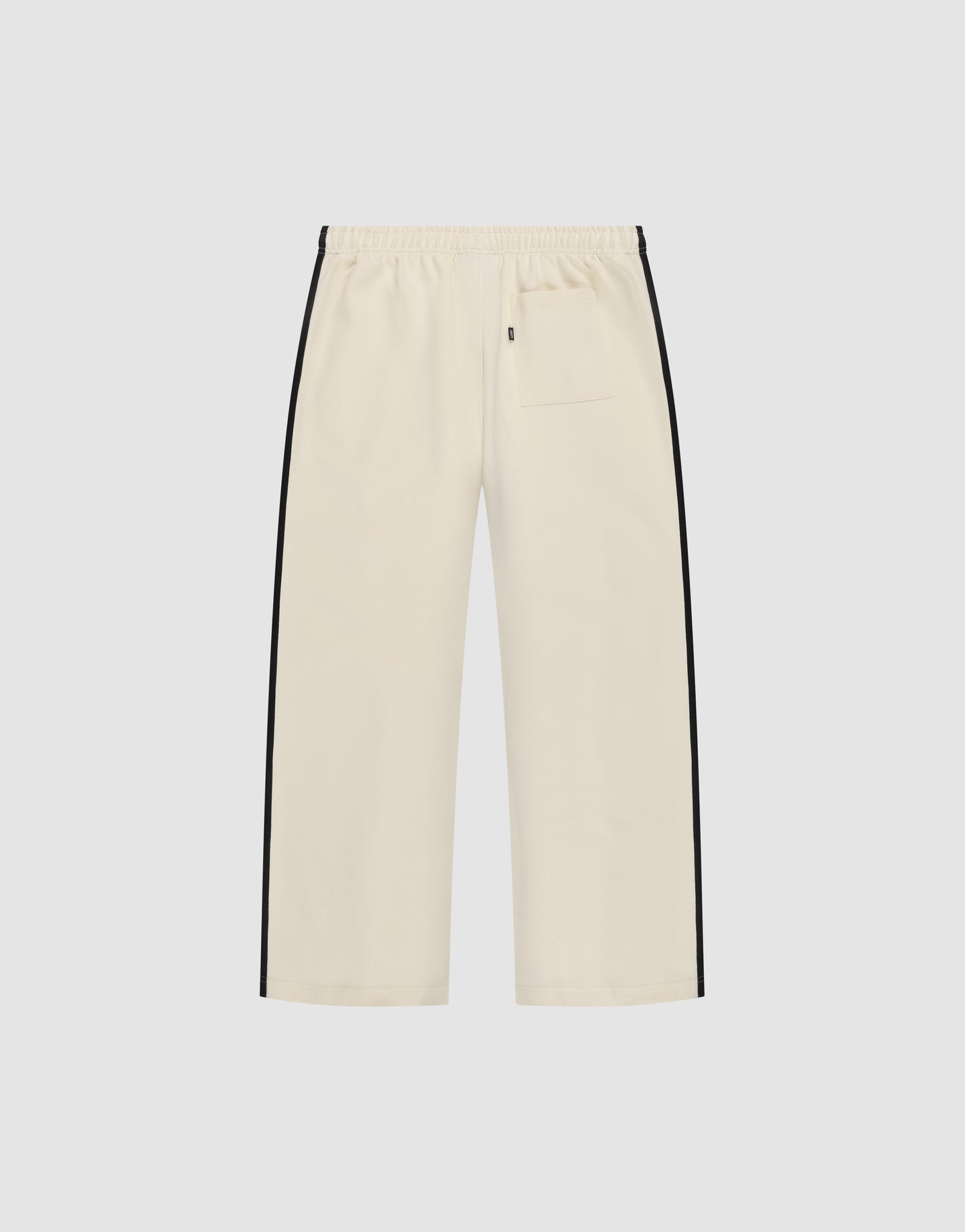 The LFDY Striped Jogger by LIVE FAST DIE YOUNG features a cream color, wide fit, elastic waistband, black herringbone side stripes, and a single back pocket, shown against a plain white background.