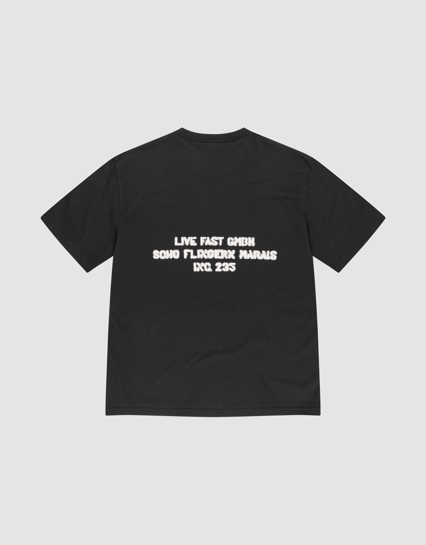 The LFDY District Tee by LIVE FAST DIE YOUNG is a black Regular Fit t-shirt made from 100% cotton, featuring bold front and back prints with white text on the back: "LIVE FAST GMBH SOHO FLOROICK MARAIS INC 235.
