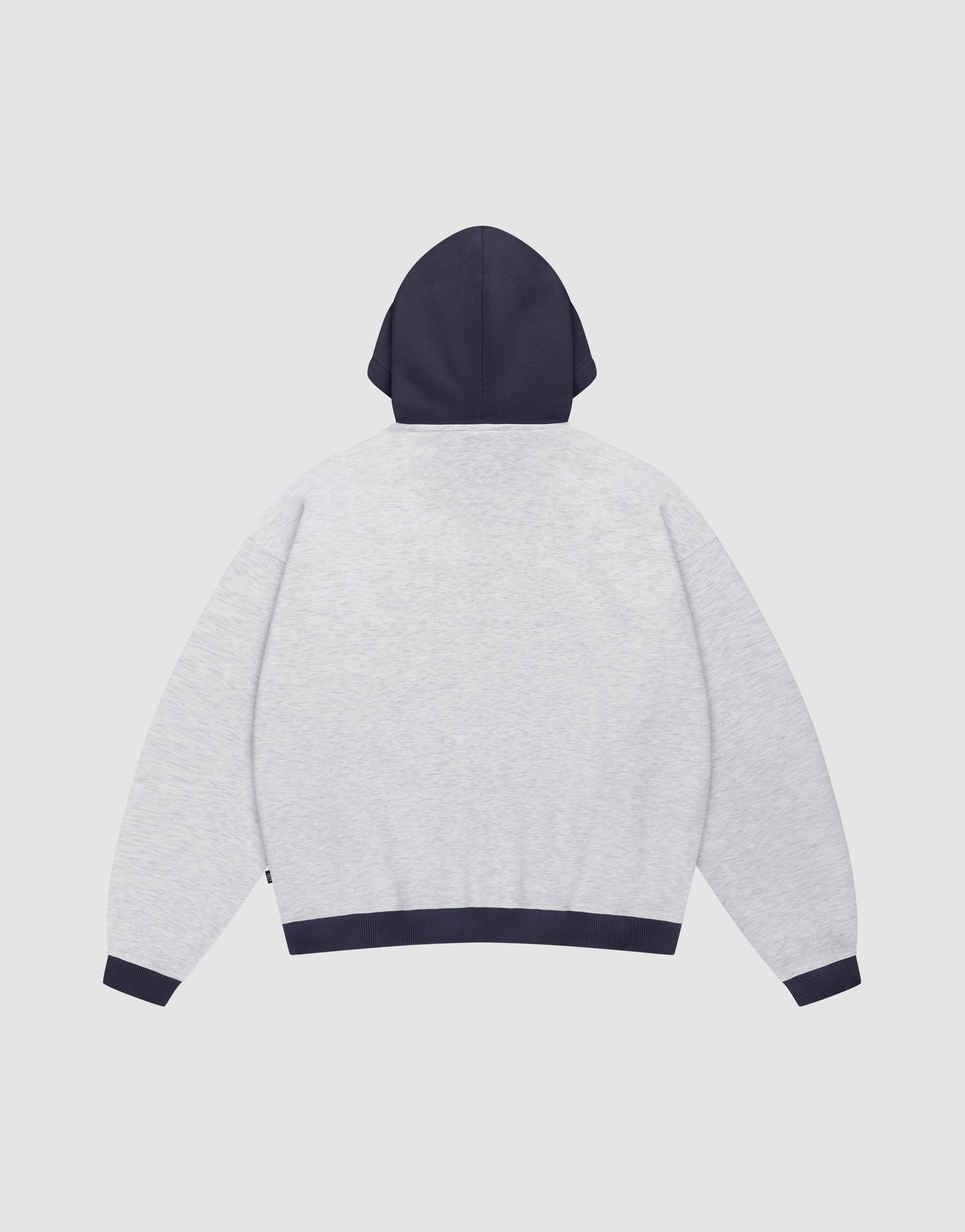A back view of the LFDY District Hooded by LIVE FAST DIE YOUNG, an oversize fit hoodie in light gray with contrasting dark navy hood, waistband, and cuffs, laid flat on a white background.