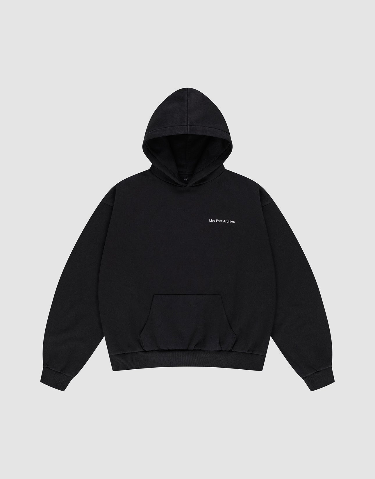 The LFDY Middlefinger Hooded by LIVE FAST DIE YOUNG is a plain black oversized pullover with a front pocket, small white "Live Fast Archive" text on the left chest, subtle front and back prints, shown on a light gray background.