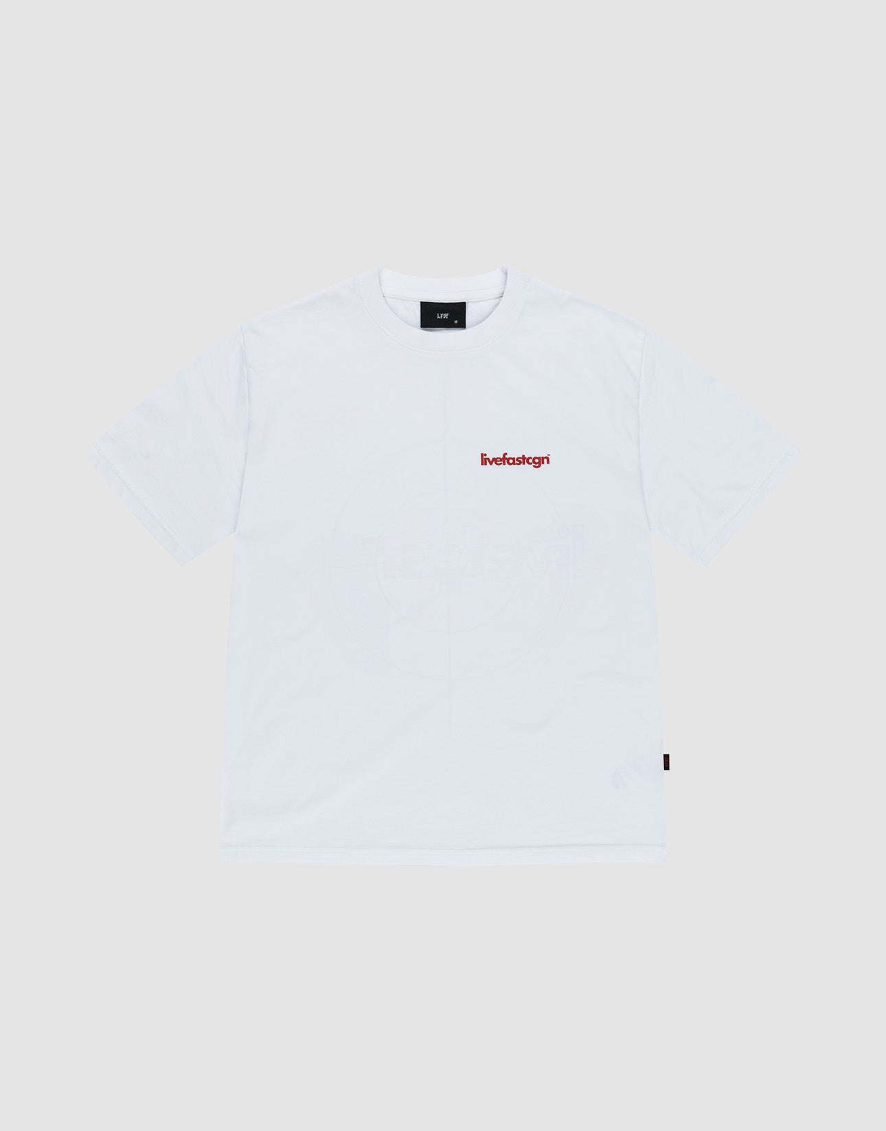 The Live Fast Target Tee by LIVE FAST DIE YOUNG is a plain white short-sleeve Cologne Regular Fit t-shirt with a small red livefastcgi logo on the left chest, shown on a light gray background. Made from 100% Baumwolle for comfort.
