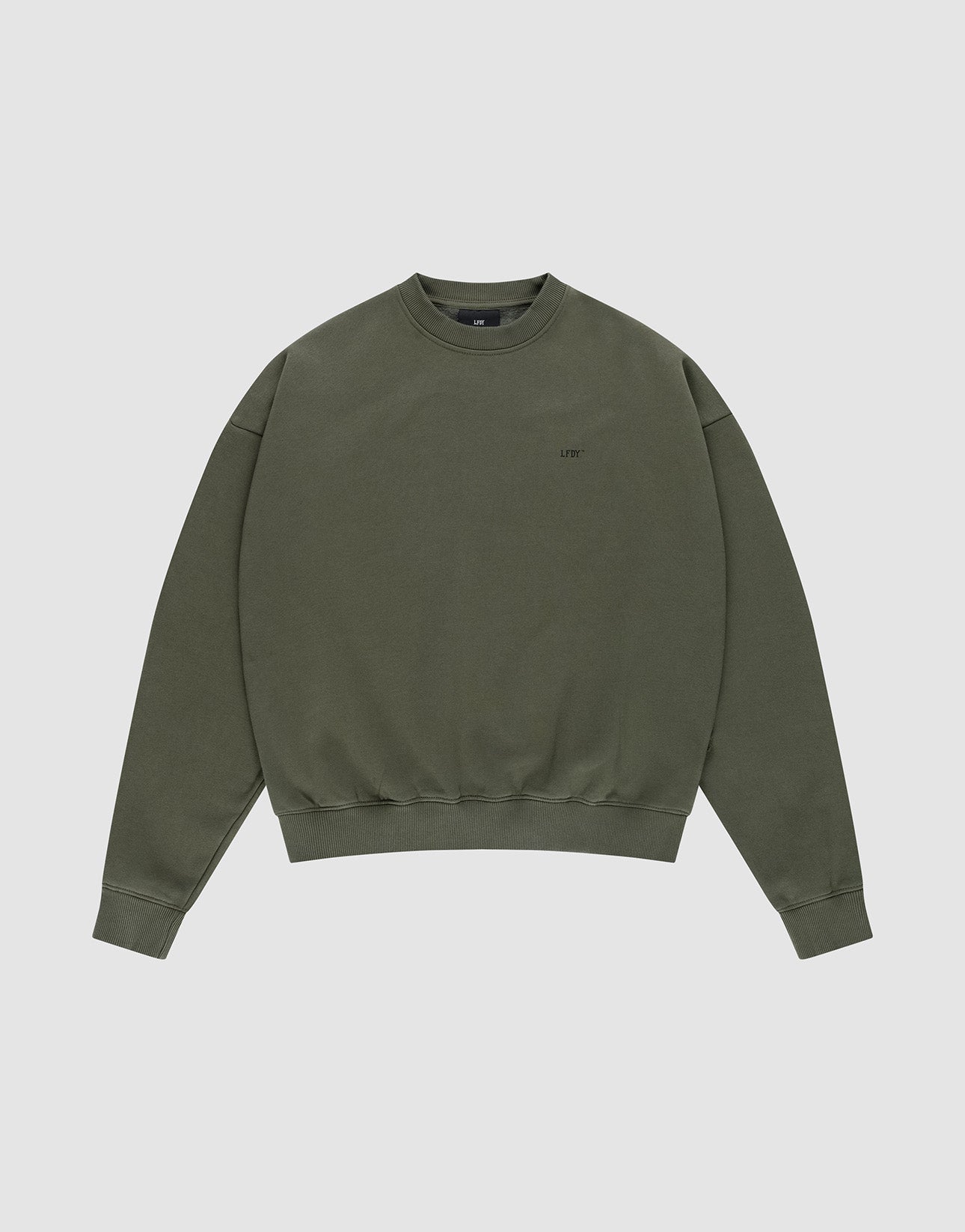 The LFDY BLP Sweater by LIVE FAST DIE YOUNG is an olive green oversize fit crewneck with long sleeves, ribbed cuffs and hem, and a small logo print on the left chest, made from a cotton-polyester blend and shown on a light gray background.