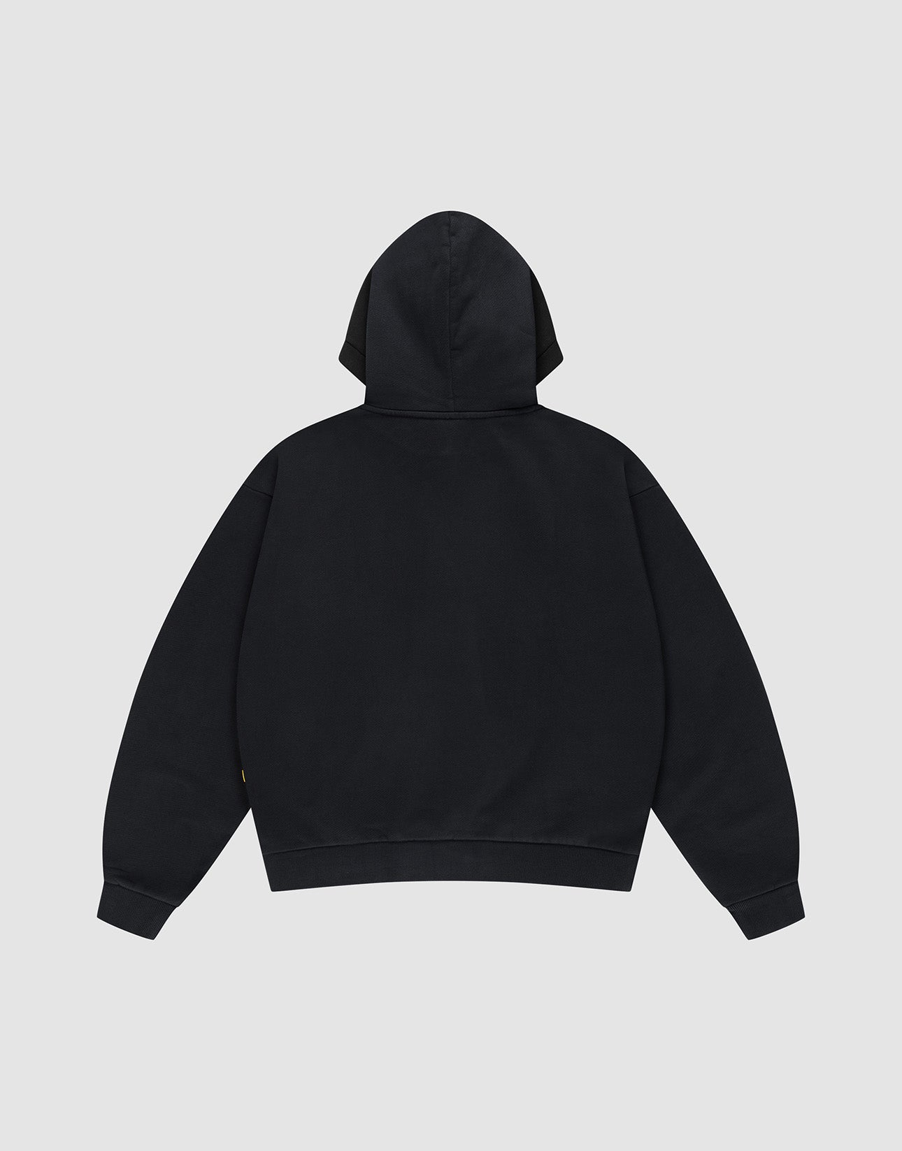 The LFDY The Bulldog Hooded by LIVE FAST DIE YOUNG is shown in an oversize fit, plain black, displayed from the back with the hood up and sleeves flat on a light gray background.