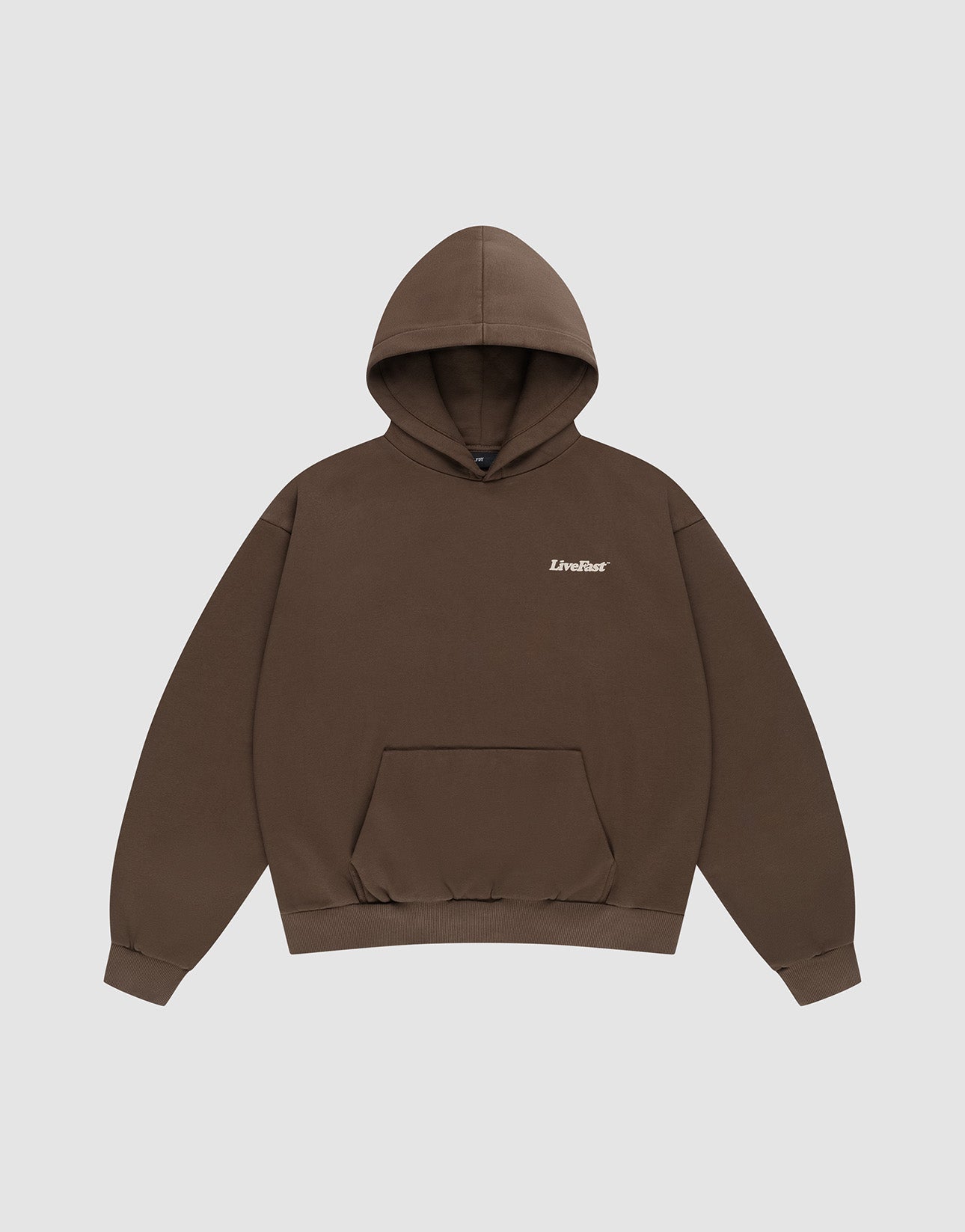 The Basic 360 Hooded by LIVE FAST DIE YOUNG is an oversized brown sweatshirt with a front pocket and “LiveFast” in white on the left chest, made from cotton-polyester blend, shown on a plain light gray background.
