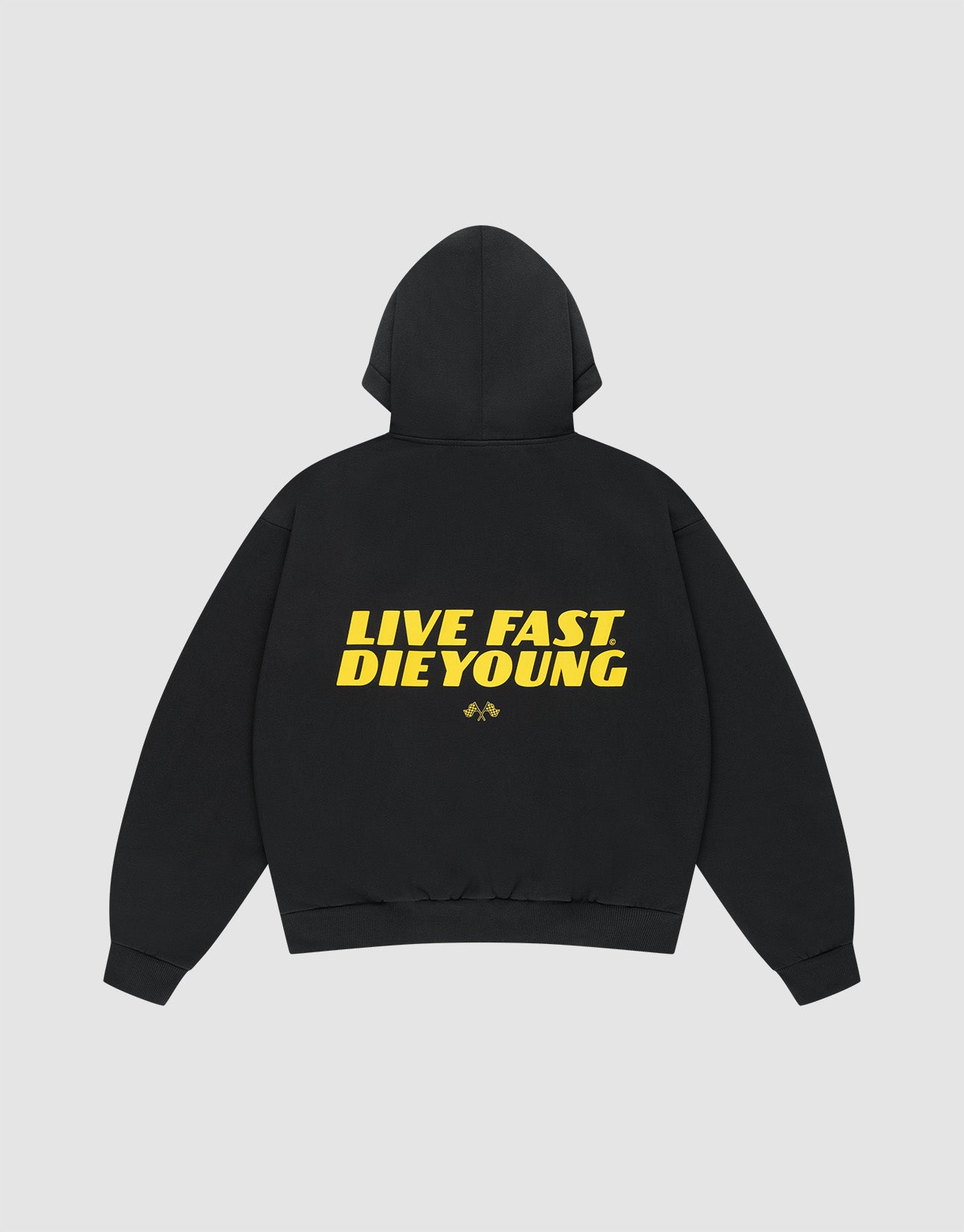The LFDY Drift Hooded by LIVE FAST DIE YOUNG is a black oversized hoodie with a doppellagige Kapuze, bold yellow "LIVE FAST DIE YOUNG" text and a small yellow graphic on the back, made from soft Baumwolle and shown on a plain light background.