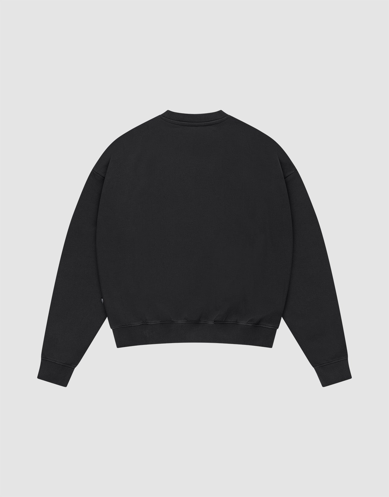 The LFDY Supply Sweater by LIVE FAST DIE YOUNG is shown laid flat, back up, on a light gray background. This oversized black crewneck features a soft Baumwolle-Polyester blend, long sleeves, and ribbed cuffs and hem.
