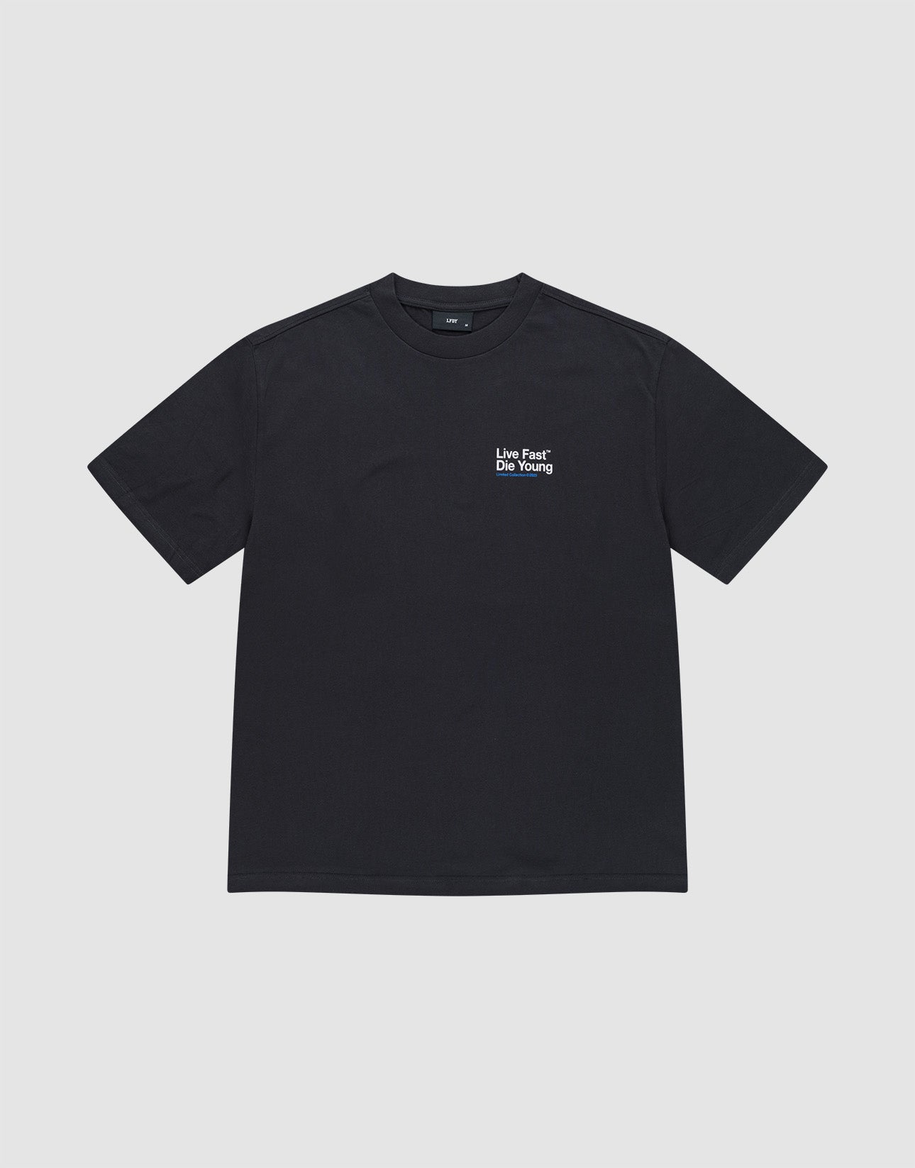 The Live Fast NY Tee by LIVE FAST DIE YOUNG is an oversized black cotton short-sleeve t-shirt with “Live Fast* Die Young” in white on the left chest, shown against a light gray background.