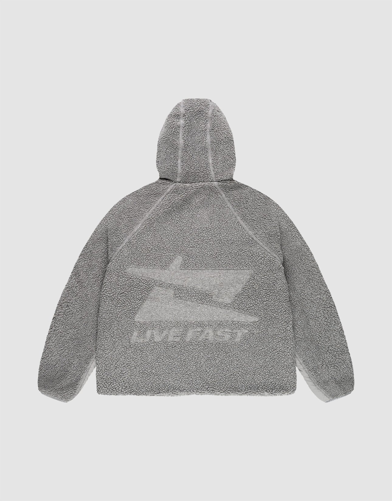 The LIVE FAST DIE YOUNG Live Fast Teddy Jacket is shown from the back in gray with a textured finish, bold jet graphic, and "LIVE FAST" in white on the lower back. Raglan sleeves complete this comfortable, standout look.