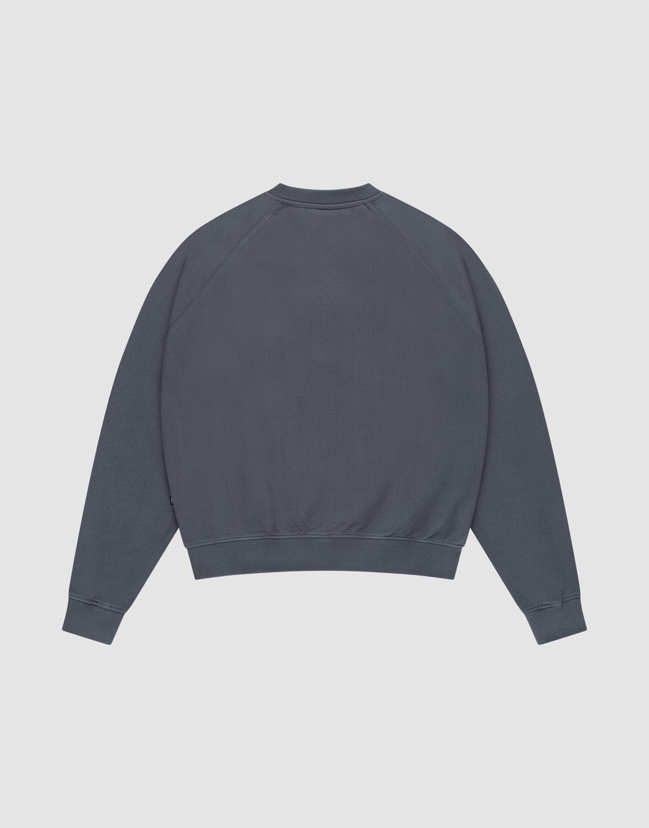 The DY Sweater by LIVE FAST DIE YOUNG is a solid dark gray, long-sleeve crewneck with an Oversize Fit for extra comfort, shown from the back against a light gray background.